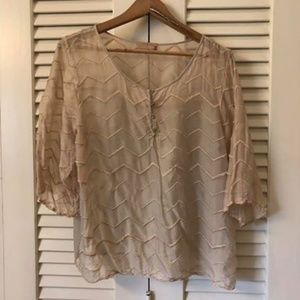 Nude blouse with 3/4 inch sleeves